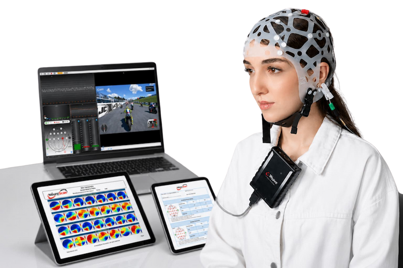 Clinician reviewing brainwave data for neurofeedback and QEEG assessment